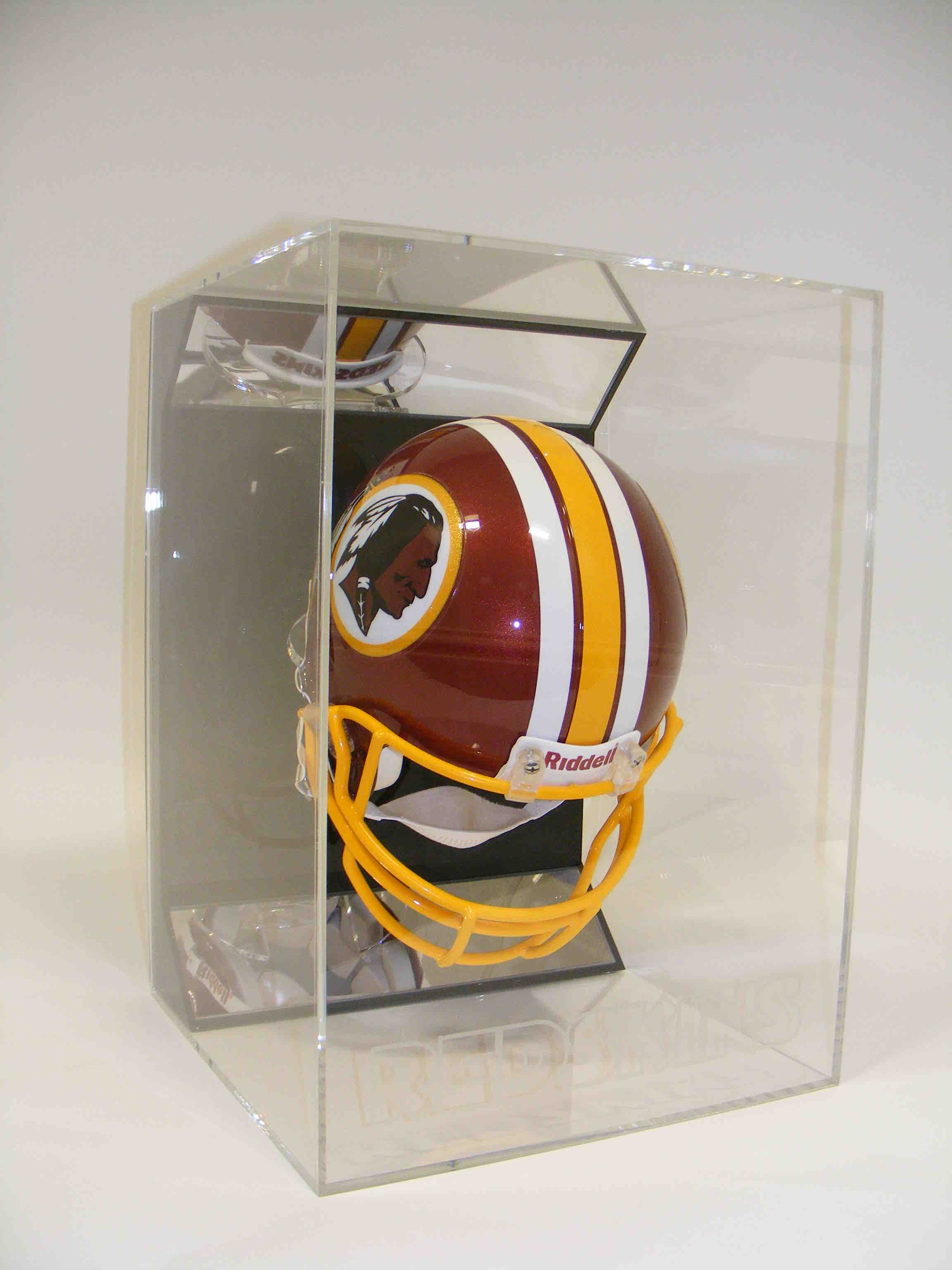 Riddell mini American football helmet in a clear acrylic display case against a white background